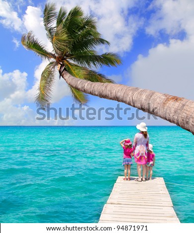 Daughters and mother in jetty on Formentera with turquoise sea [photo illustration]