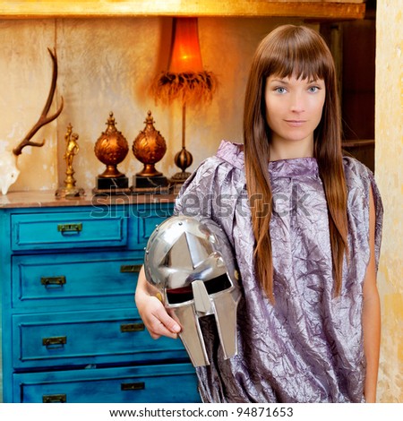 Futuristic fashion woman in retro grunge home with steel helmet