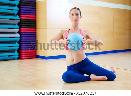 Pilates woman stability ball exercise workout at gym indoor
