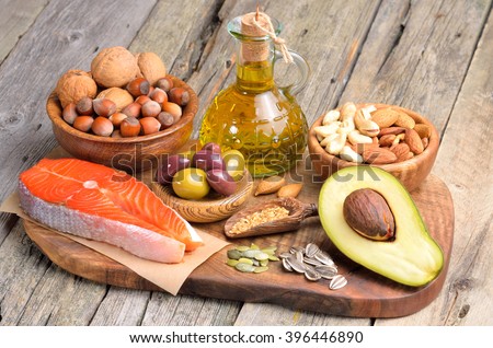Selection of healthy fat sources on wooden background. Imagine de stoc © 