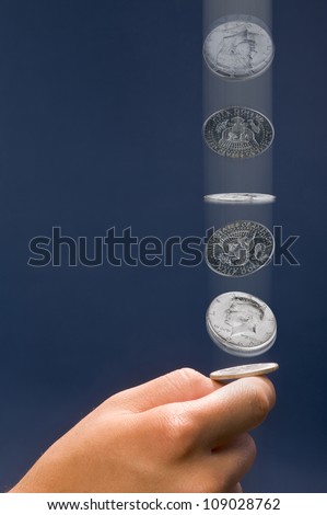 Coin Toss With Silver Half Dollar.