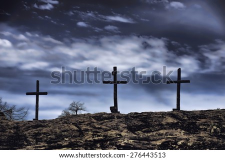 The old rugged wooden cross of the christian church.