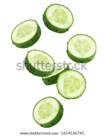 Falling cucumber slice isolated on white background, clipping path, full depth of field