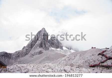 snow mountain range and clouds - Jade Dragon Snow Mountain or Mount Yulong in Lijiang country, Yunnan province