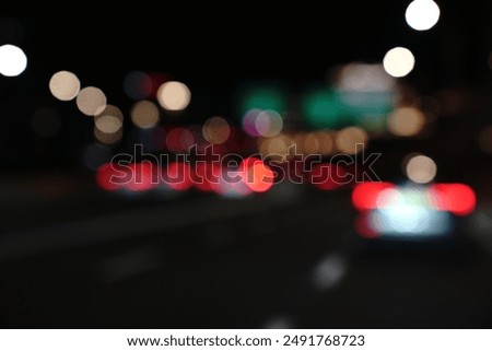 Similar – Foto Bild bunte Straßenlaternen bei Nacht auf der Straße