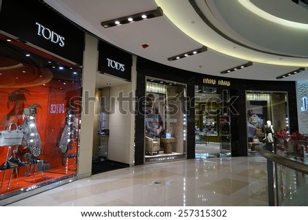 SHANGHAI, CHINA - March 2. 2015: Interior of the new IAPM Shopping Mall downtown in old French Concession. TOD\'S brand store inside Just after Chinese new year at March 2. 2015 Shanghai, China