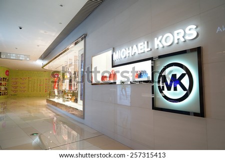 SHANGHAI, CHINA - March 2. 2015: Interior of the new IAPM Shopping Mall downtown in old French Concession. Michael Kors brand store inside Just after Chinese new year at March 2. 2015 Shanghai, China