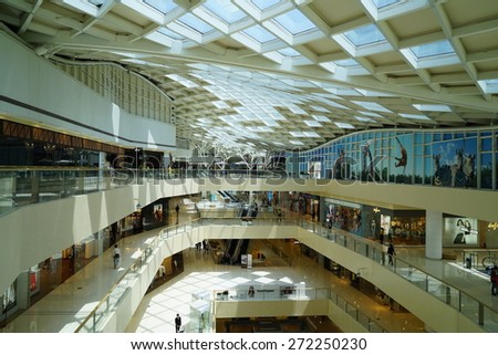 SHANGHAI, CHINA - APRIL 22, 2015.: Interior of the IFC Shopping Mall downtown in Pudong Lujiazui. The ceiling design is very special.Multi fashion brand inside.