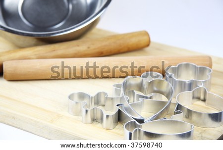 baking tin and other equipment on white background