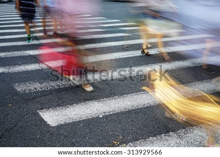 Crosswalk and pedestrian at modern city zebra crossing street, blur abstract