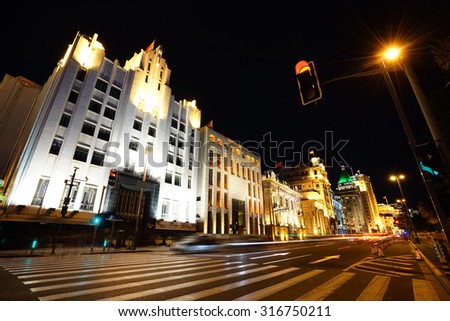 shanghai bund at night ,excellent historical buildings with vehicle trails of light on the street.