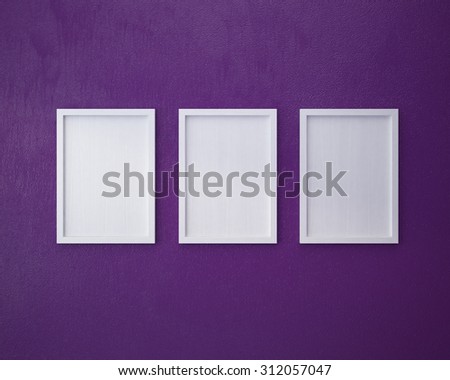 3 Blank frame on  purple wall.
