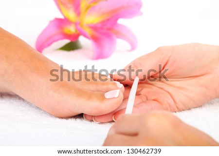 Beauty treatment photo of nice pedicured feet