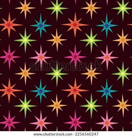 Mid Century Modern colorful Atomic starbursts seamless pattern in orange, pink, red, green and blue on dark brown background. For retro posters, home décor, stationary and fabric