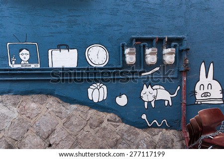 Seoul, South Korea - December 7, 2014: Art Painted Wall, Graffiti Art and Sculpture Adorn The Street of The Ihwa Mural Village.