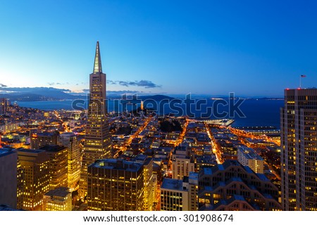 city lights of downtown san francisco and bay at dusk