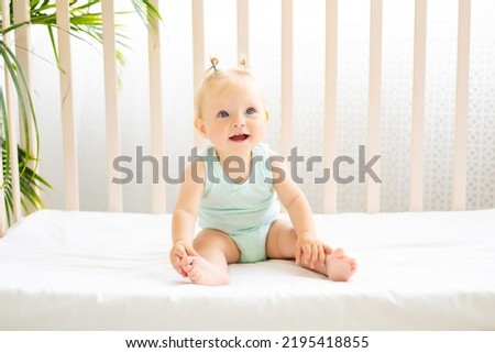 Similar – Image, Stock Photo beautiful baby girl laughing at home sitting on the sofa