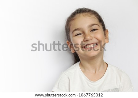 Similar – Image, Stock Photo Happy little girl with fringe hairstyle on the side in the lower part of the picture with view to the frame