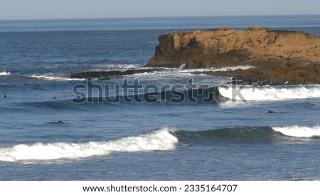 Similar – Image, Stock Photo Anonymous surfer at the beach with surfboard