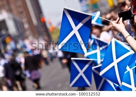 NEW YORK - APRIL 14:  People holding Scottish Flags watch the parade pass on on 6th Avenue April 14, 2011 in New York, NY.