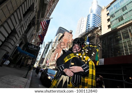 NEW YORK - APRIL 14:  A man dressed in Scottish Kilt practices his Bag Pipes before The Scotland Week Parade on 6th Avenue April 14, 2011 in New York, NY.