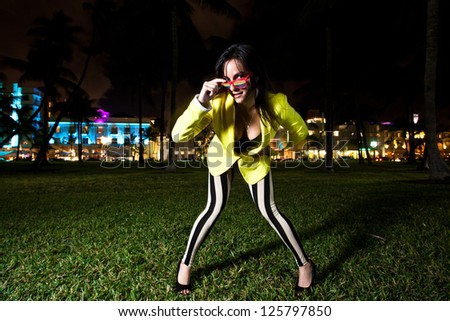 Young Woman posing and having fun on South Beach in Miami