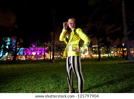Young Woman posing and having fun on South Beach in Miami