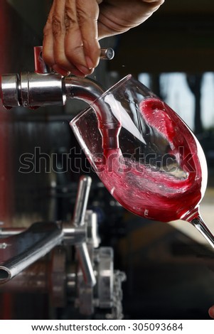 glass of red wine vineyard tap