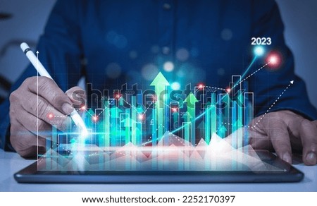 business growth calculation concept 2023 businessman calculates financial data for long term investment Analytical businessman planning business growth in 2023, business strategy, finance, planning Stock fotó © 