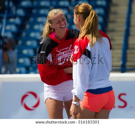 TORONTO, CANADA - AUGUST 9 :  Petra Kvitova talks to Lucie Safarova during a celebrity ball hockey game at the  2015 Rogers Cup WTA Premier 5 tennis tournament