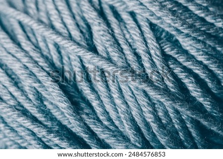 Similar – Image, Stock Photo Close-up of a knitted piece with wooden knitting needles and ball of wool