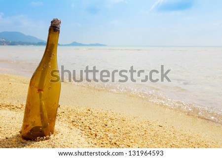 Bottle with a message on tropical island