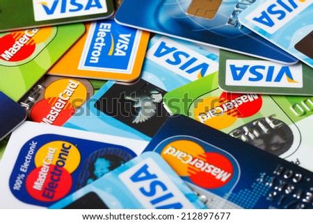 KIEV, UKRAINE - July 7: Pile of credit cards, Visa and MasterCard, credit, debit and electronic, in Kiev, Ukraine, on July 7, 2014.