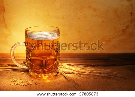 beer on sacking with wheat in ambient light  still-life