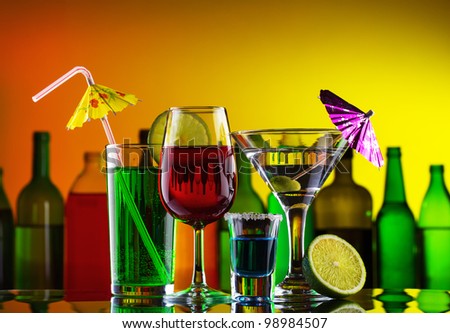 Different alcohol drinks and cocktails on bar