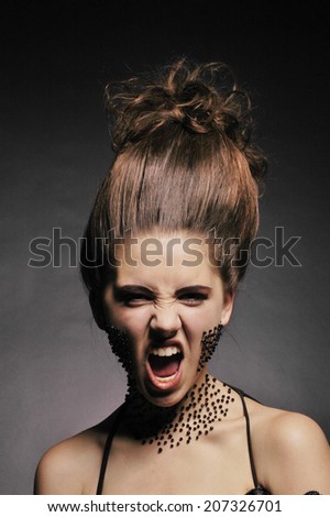 Fine art photo of crying fashion woman on black background