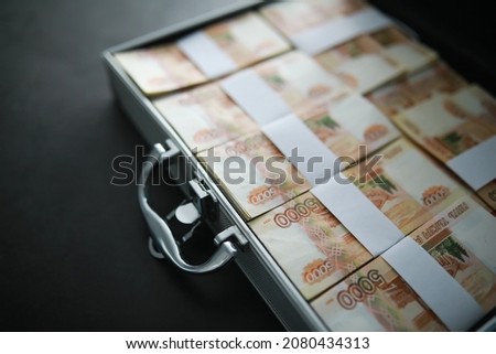 A metal suitcase filled Russian banknotes of 5000 rubles. Investment, bribe, corruption concept. 商業照片 © 