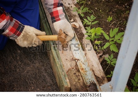 installation work to hammer a nail