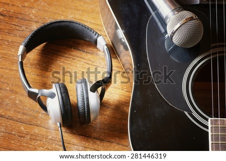 instrument guitar headphones and microphone