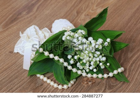 Wedding bouquet of lilies of the valley accessory ring