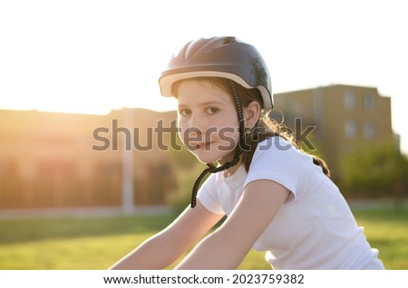 Similar – Image, Stock Photo 11 Cyclists ride one after the other on a dam