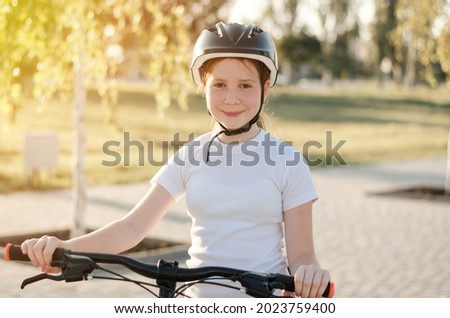 Similar – Image, Stock Photo 11 Cyclists ride one after the other on a dam