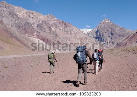 MENDOZA, ARGENTINA  - JAN 12: Unidentified climbers on the path to Plaza de Mulas.This year, 35000 people faced the mountain intend to get the summit. Jan 12, 2012 in Aconcagua Mount, Mendoza, Argentina.