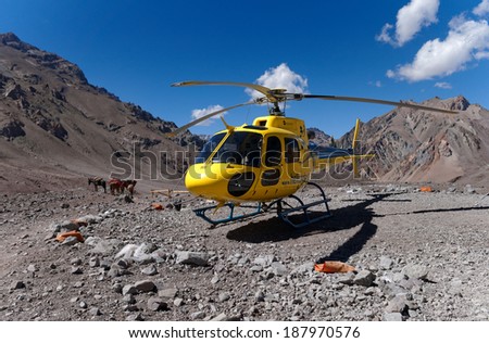 MENDOZA, ARGENTINA - JAN 15: Rescue Helicopter at Plaza de Mulas .  Org. help manage the risk of climbing. This season 140 people were evacuated. Jan 15, 2014 in Aconcagua Mount, Mendoza, Argentina