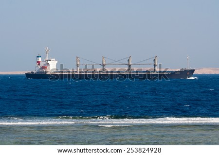 SHARM EL SHEIKH, EGYPT - NOVEMBER 21: Bulk Carrier Valopoula sails along the shore of the Red Sea near Sharm El Sheikh, Egypt at November 21, 2010. Type of vessel: Bulk Carrier. Flag: Bahamas.