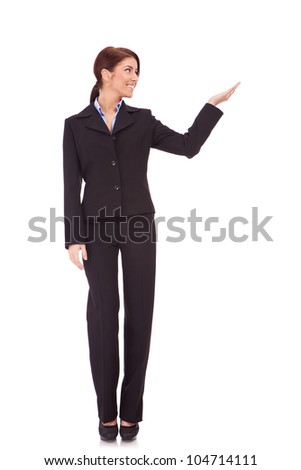 full body picture of a business woman presenting something imaginary over white background