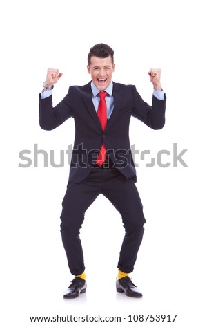 funny looking business man in suit and yellow socks, winning on white background