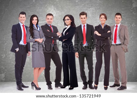 Successful happy business team formed by business men and women, isolated on white