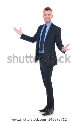 full length picture of a young business man welcoming you with his arms wide open and with a smile on his face. on white background