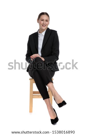 Similar – Image, Stock Photo Elegant woman sitting against brick wall